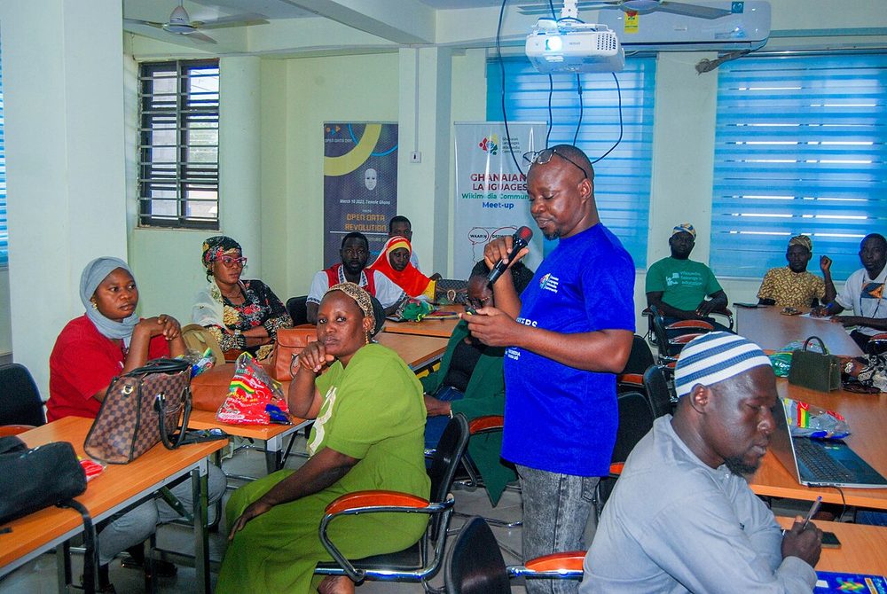 Teachers seated at tables during a training session in a classroom